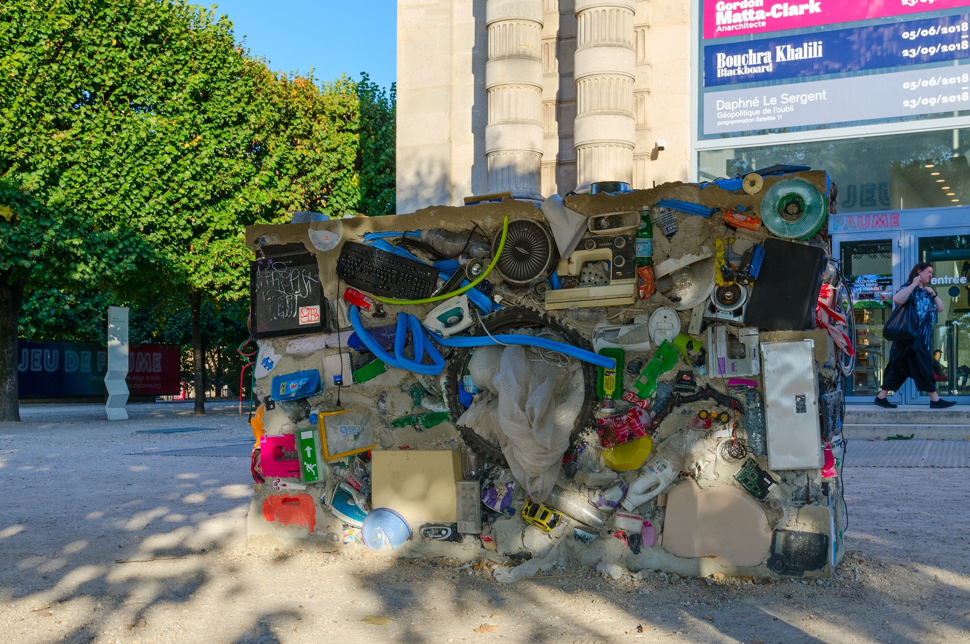 Modern installation of garbage, household items and household appliances at Galerie nationale du Jeu de Paume, Paris, France