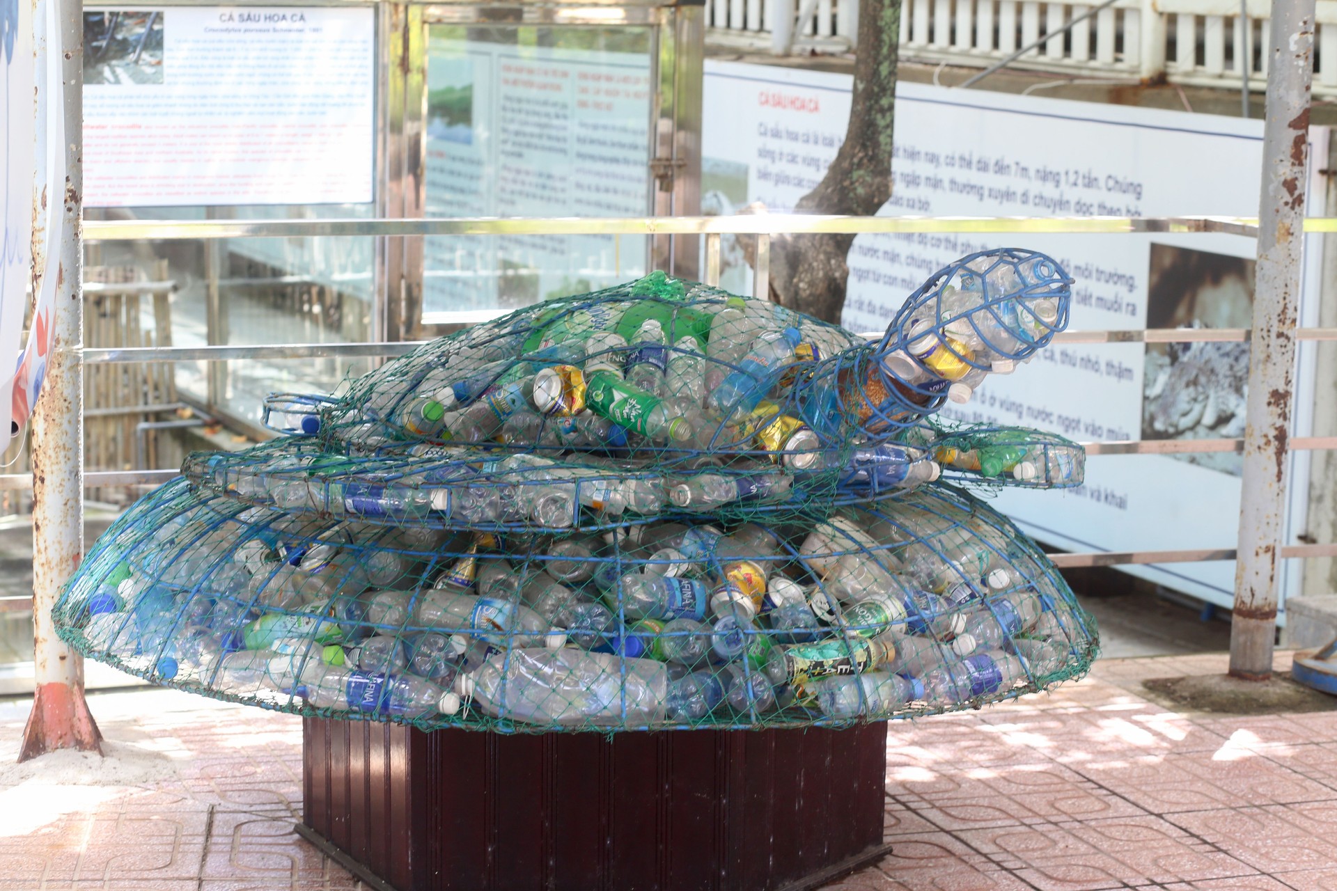 Nha Trang City, Vietnam - Oct 18, 2021: A turtle made from plastic bottles and an iron frame sends a message to reduce plastic waste at the Institute of Oceanography, Nha Trang